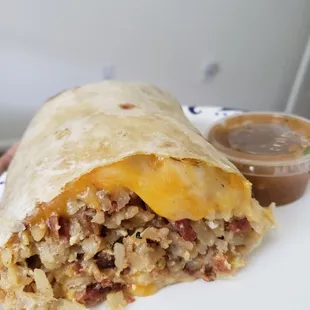 a burrito on a white plate