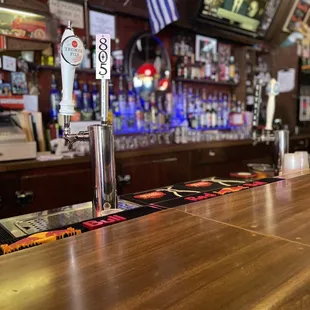 he bar's wooden bar top