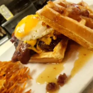  waffle sandwich with bacon, eggs, and hash browns