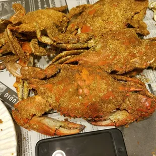 wo crabs on a newspaper