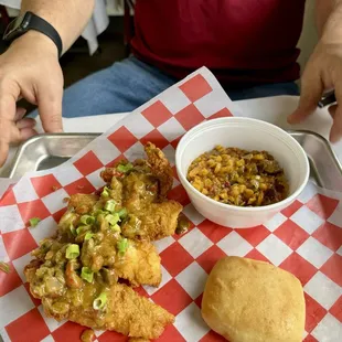 Fried catfish strips topped with crawfish etouffee