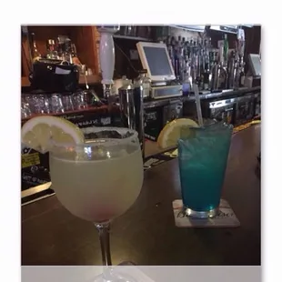 a photo of two cocktails