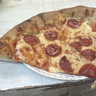 a slice of pepperoni pizza