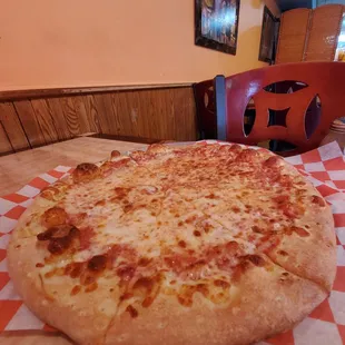 a cheese pizza on a table