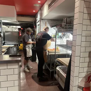 two people in a kitchen