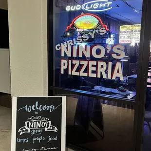 a sign in front of a restaurant
