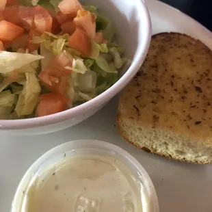 Small garden salad comes with garlic bread