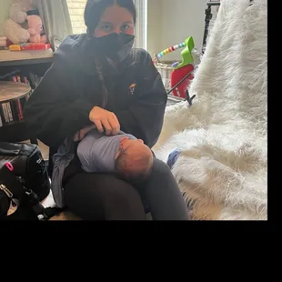 Christen webb working with 3 week old baby boy