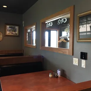 a dining area with tables and benches