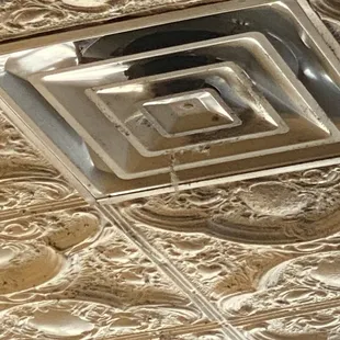 The dirt that was hanging from the vent could have easily landed in someone's food.