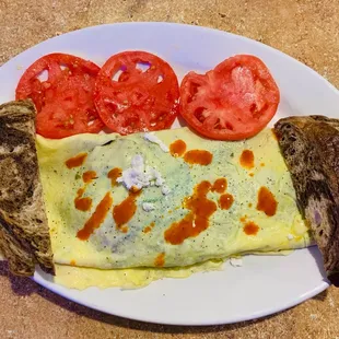 Spinach &amp; feta omelette with added mushrooms, rye toast, and sliced tomatoes instead of home fries or grits