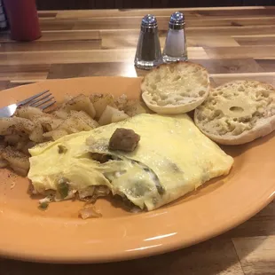 Italian omelette with home fries and a English muffin.
