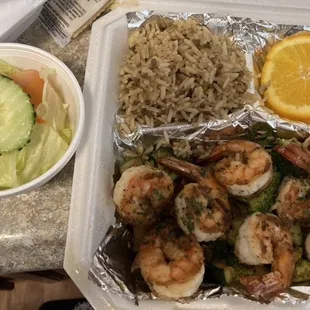 Grilled jumbo shrimp with dirty rice, grilled veggies and salad