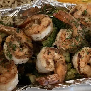 Grilled shrimp on bed of grilled broccoli and zucchini