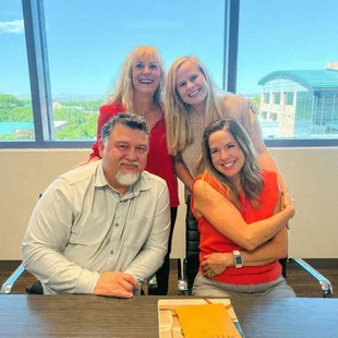 Happy couple closing on a property for their parents to live just a few houses away.