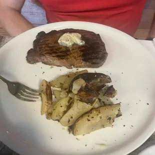 Ribeye perfectly cooked and tender. Get the truffle compound butter and you won&apos;t regret it