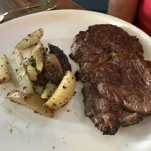Ribeye steak and rustic skillet potatoes