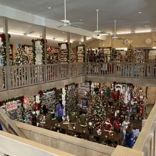 Two levels of Christmas ornaments and decor