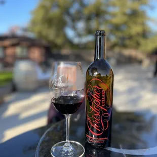 a glass of wine and a bottle of wine