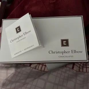 Lovely box, menu. The box is tied with a brown bow. It's gone because I couldn't wait to eat a chocolate!