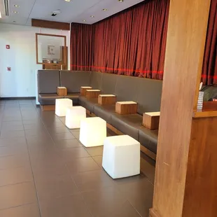 a row of stools in a waiting room