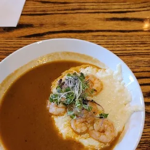 Crab cake Benedict and Shrimp and grits etouffee