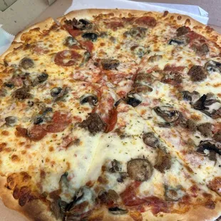 Large pizza with mushrooms, pepperoni and sausage