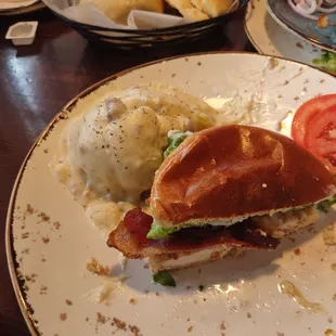 Chicken club with real mashed potato and yeast roll in the back