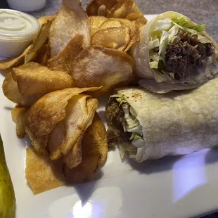 Steak and cheese wrap and hot chips