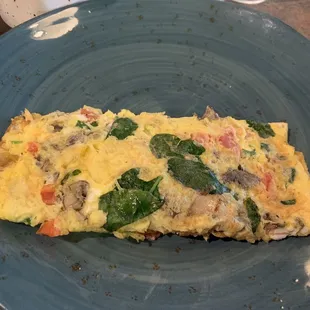 Mediterranean omelette, a big &apos;un. Comes with hash browns and toast, or two pancakes.