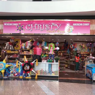 a woman standing in front of the store