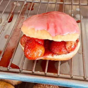 Strawberry filled heart shaped donut with fresh strawberries