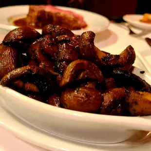 a bowl of mushrooms on a plate