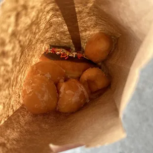 $10 for two sprinkle donuts and 1 dozen donut holes (split between two kids)
