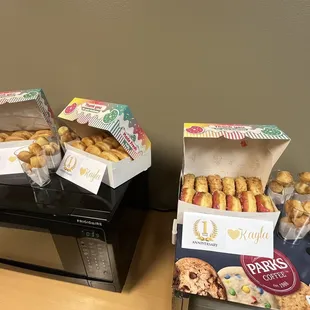 boxes of donuts and a microwave