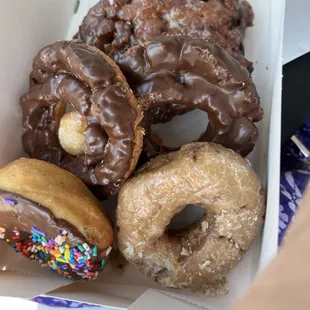 Apple fritter, chocolate old fashioned chocolate sprinkles and blueberry