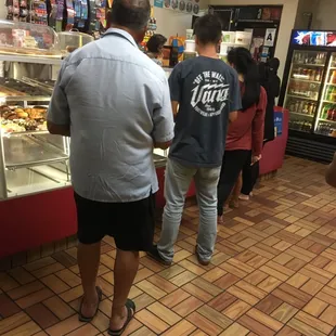 customers waiting in line at the counter