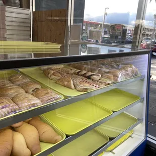 a display case filled with donuts