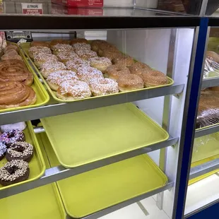 a display case filled with donuts