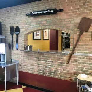 This is where the kitchen delivers the pizzas to the dining area.