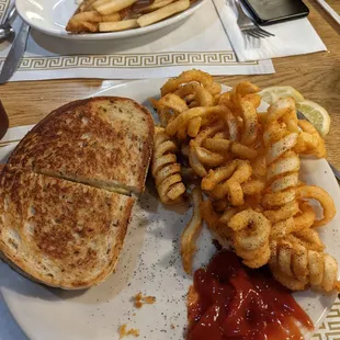 Pattymelt with curly fries.