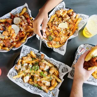 four people eating a variety of food