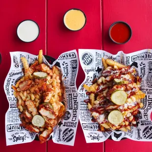 two baskets of fries on a red table