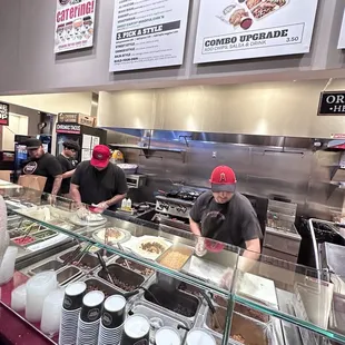 a group of people working in a restaurant