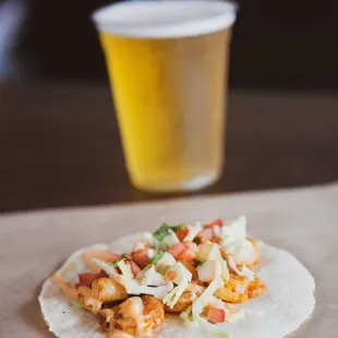 a glass of beer in the background