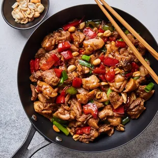 Stir Fry Kung Pao Chicken (Diced chicken m, peanuts, water chestnuts, and dried chili peppers sautéed in a spicy brown sauce).