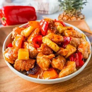 a bowl of chicken and pineapple stir fry