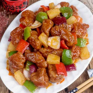 Sweet and Sour Pork ( Crispy pork with bell peppers, onions, carrots, and pineapple).