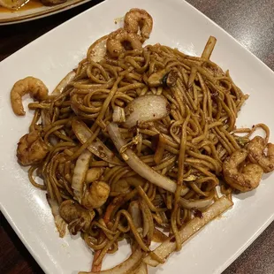 a plate of noodles and shrimp