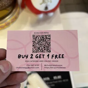 a person holding a pink ticket